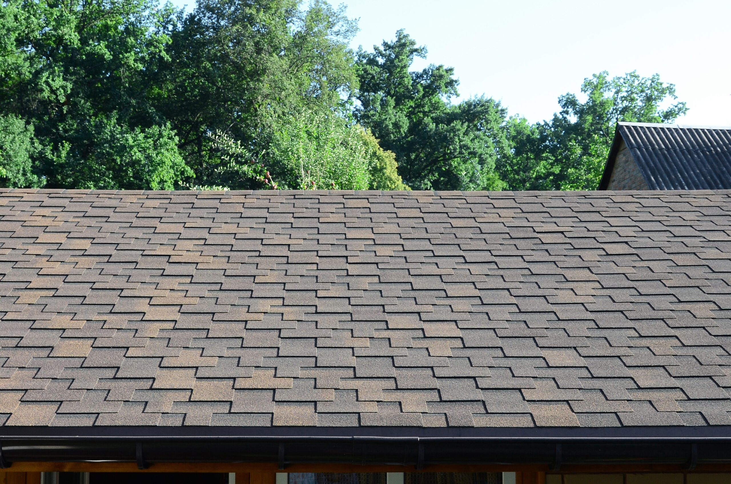 Modern roofing and decoration of chimneys. Flexible bitumen or slate shingles